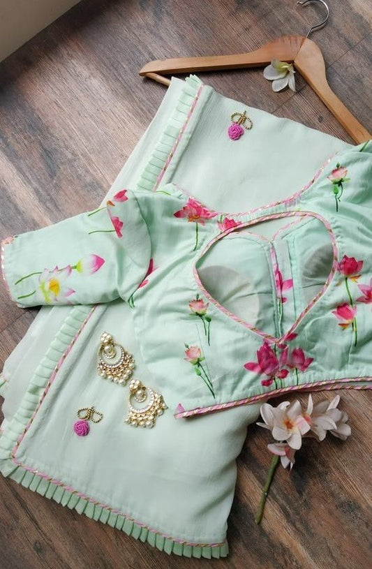 Sea green georgette ruffle layer saree