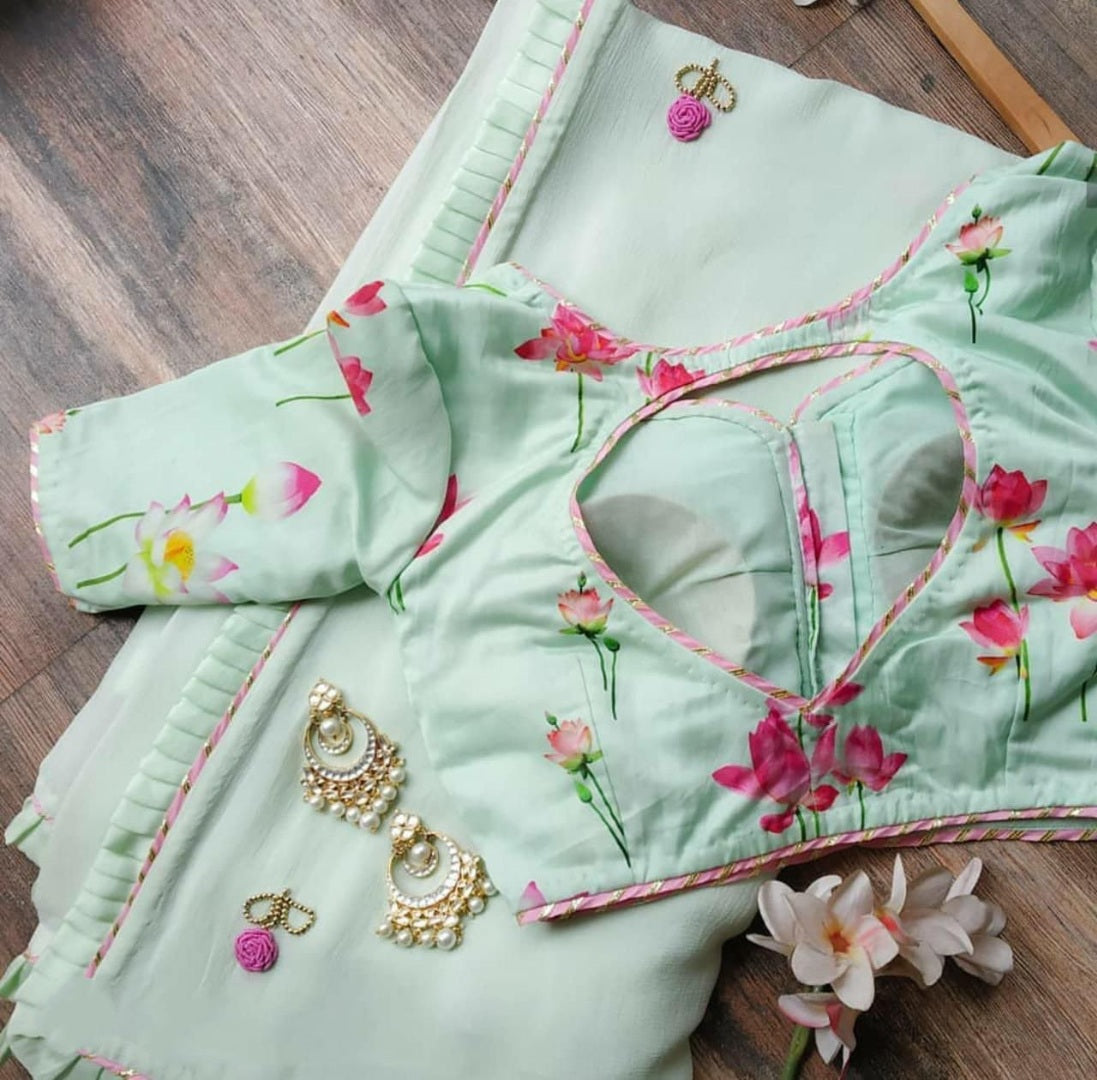 Sea green georgette ruffle layer saree