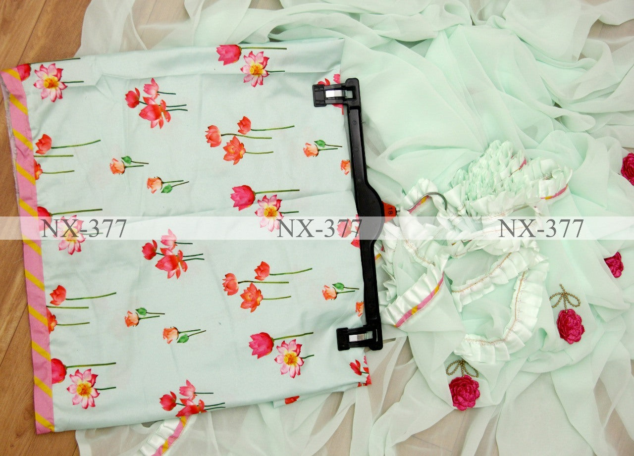 Sea green georgette ruffle layer saree