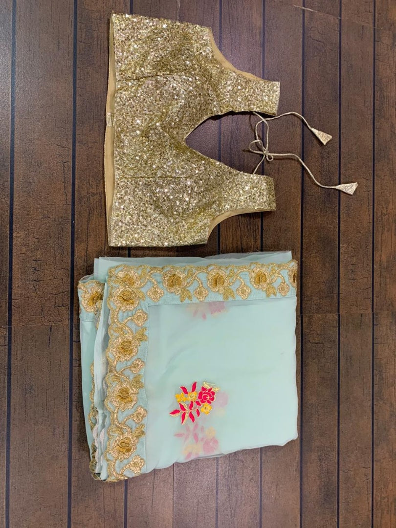 Sea green georgette thread and zari worked designer saree