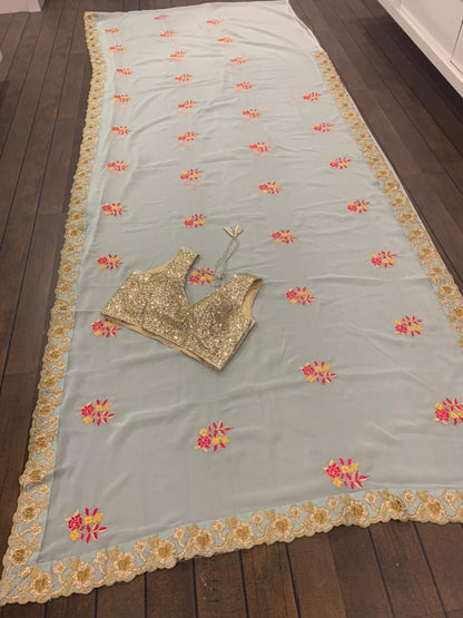 Sea green georgette thread and zari worked designer saree