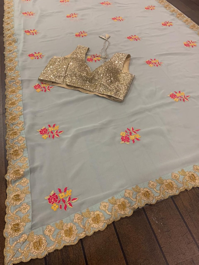 Sea green georgette thread and zari worked designer saree