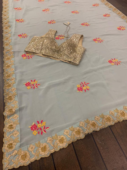 Sea green georgette thread and zari worked designer saree