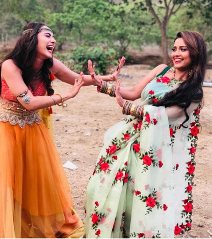 Sea green heavy net red flower embroidered saree