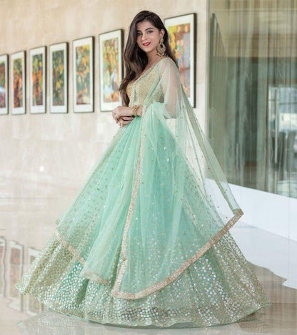 Sea green net heavy sequence work wedding lehenga choli