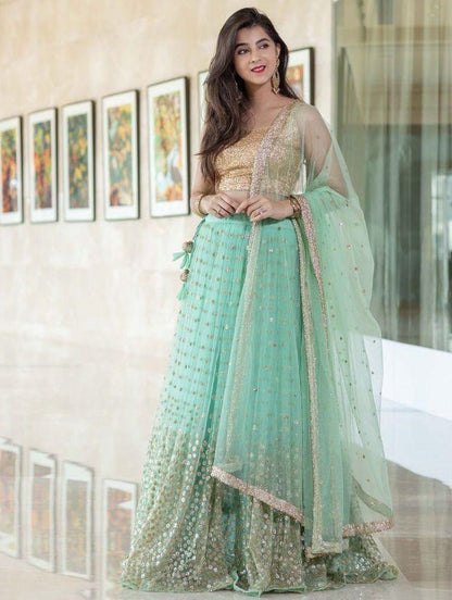 Sea green net heavy sequence work wedding lehenga choli