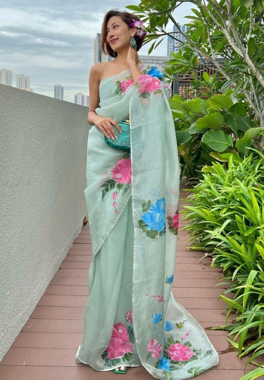 Sea green organza silk flower print and handworked saree