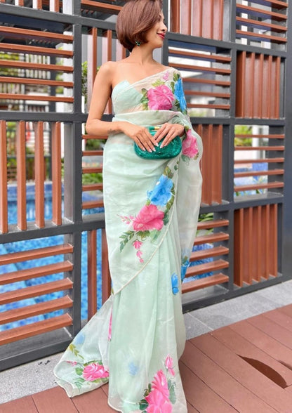 Sea green organza silk flower print and handworked saree