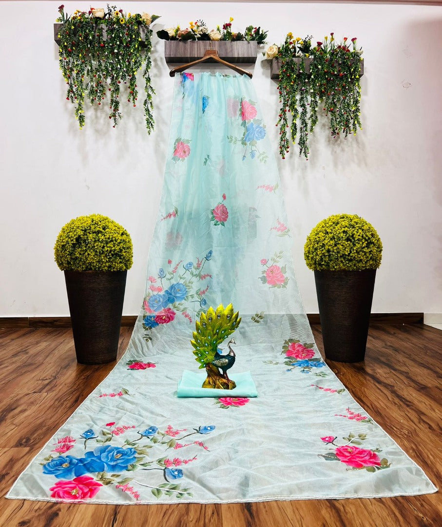 Sea green organza silk flower print and handworked saree