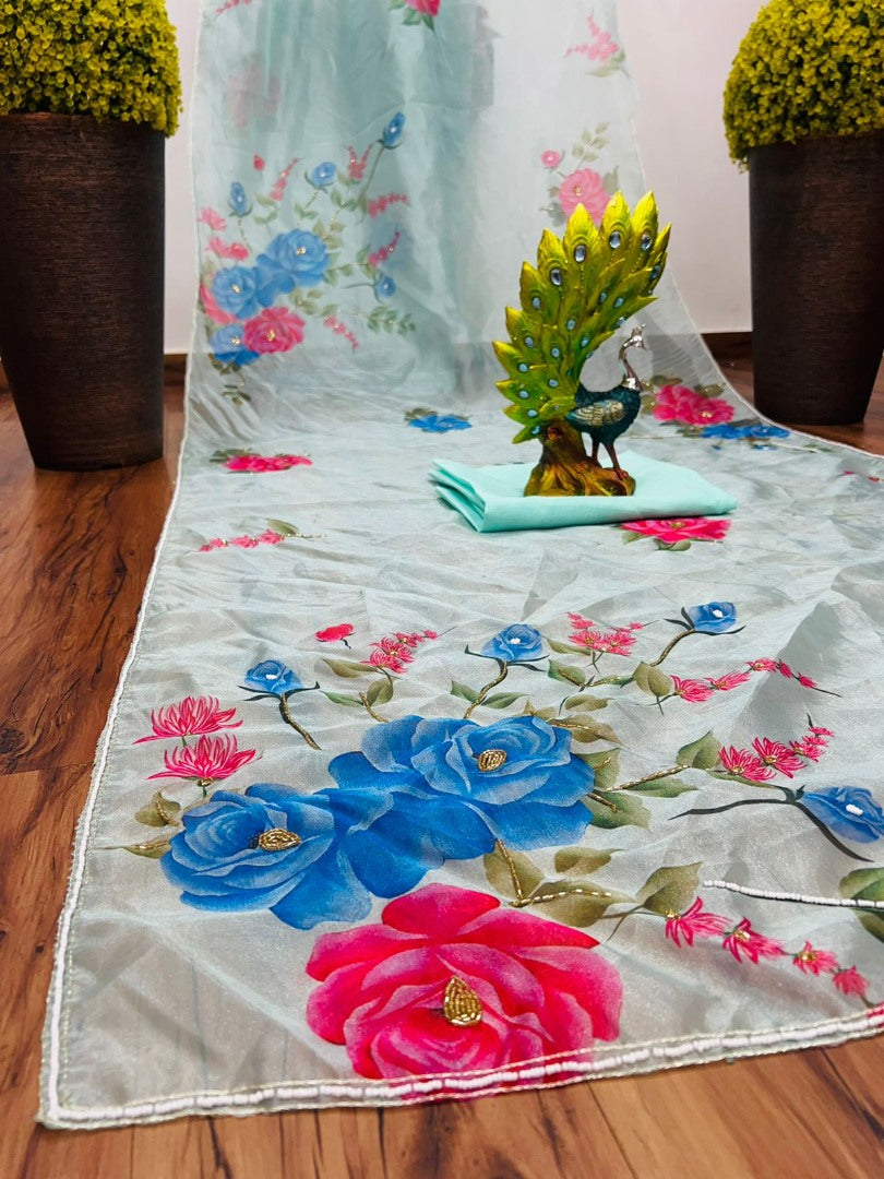 Sea green organza silk flower print and handworked saree