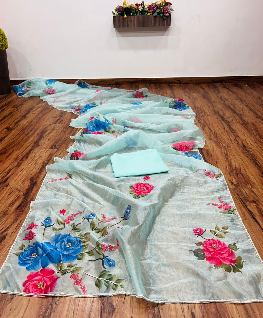 Sea green organza silk flower print and handworked saree