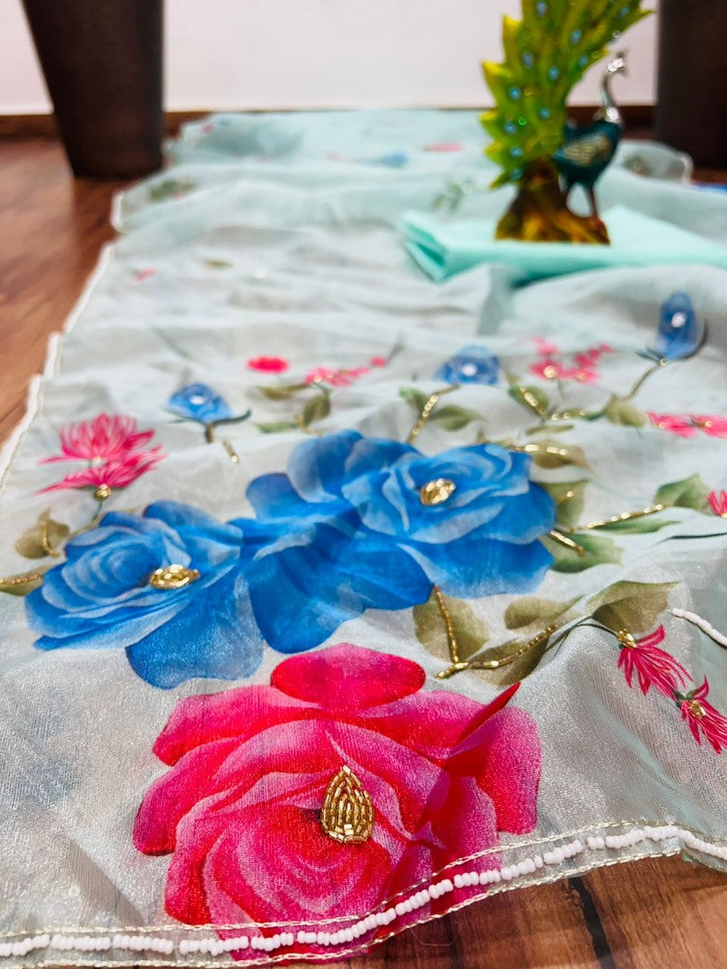 Sea green organza silk flower print and handworked saree