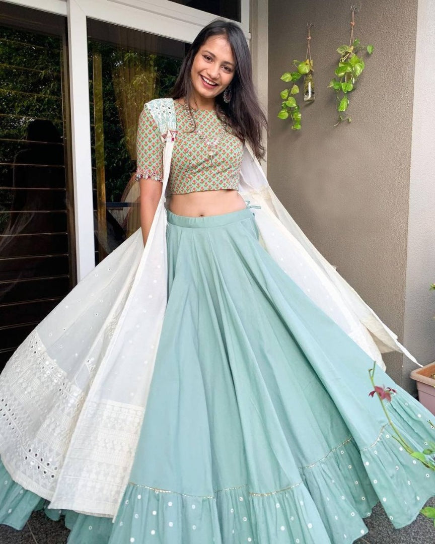 Sea green ruffle border indowestern lehenga with white embroidered shrug