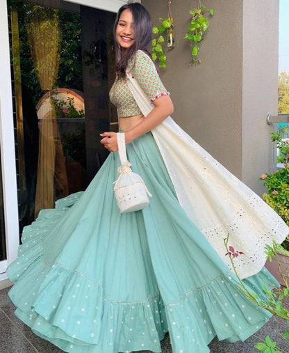 Sea green ruffle border indowestern lehenga with white embroidered shrug