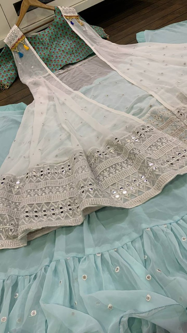 Sea green ruffle border indowestern lehenga with white embroidered shrug