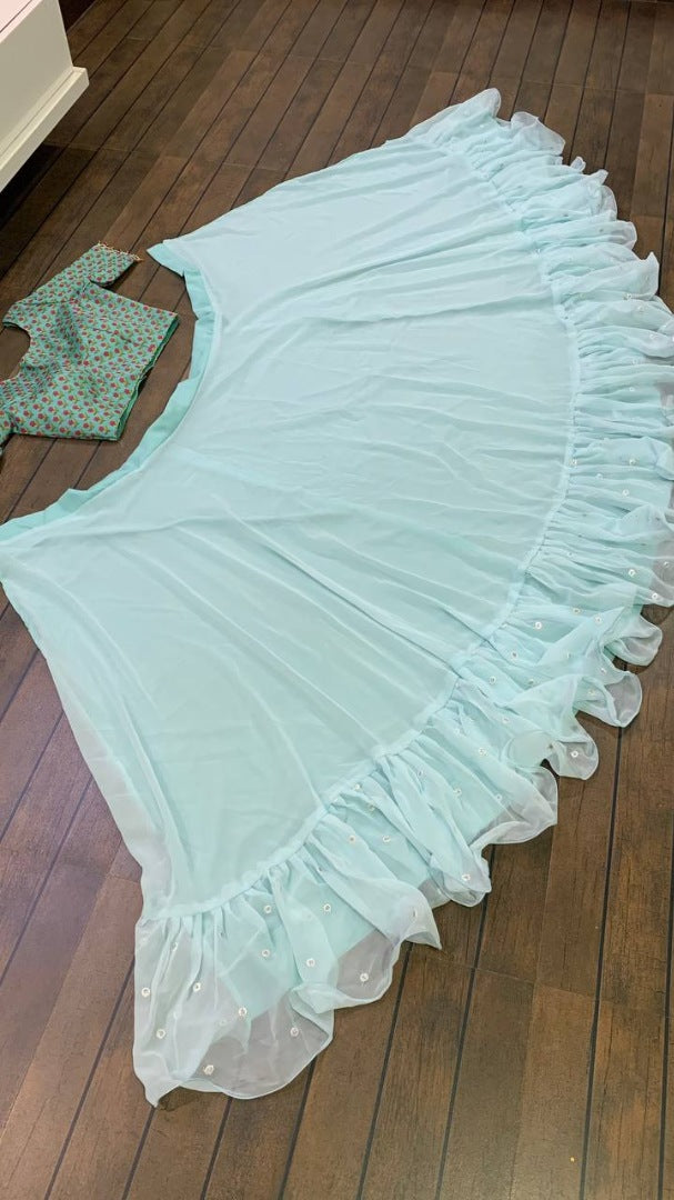 Sea green ruffle border indowestern lehenga with white embroidered shrug