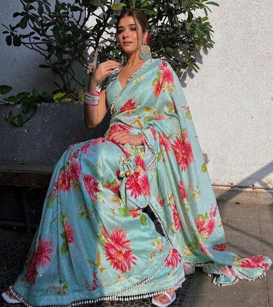 Sea green satin silk flower printed tassel border saree