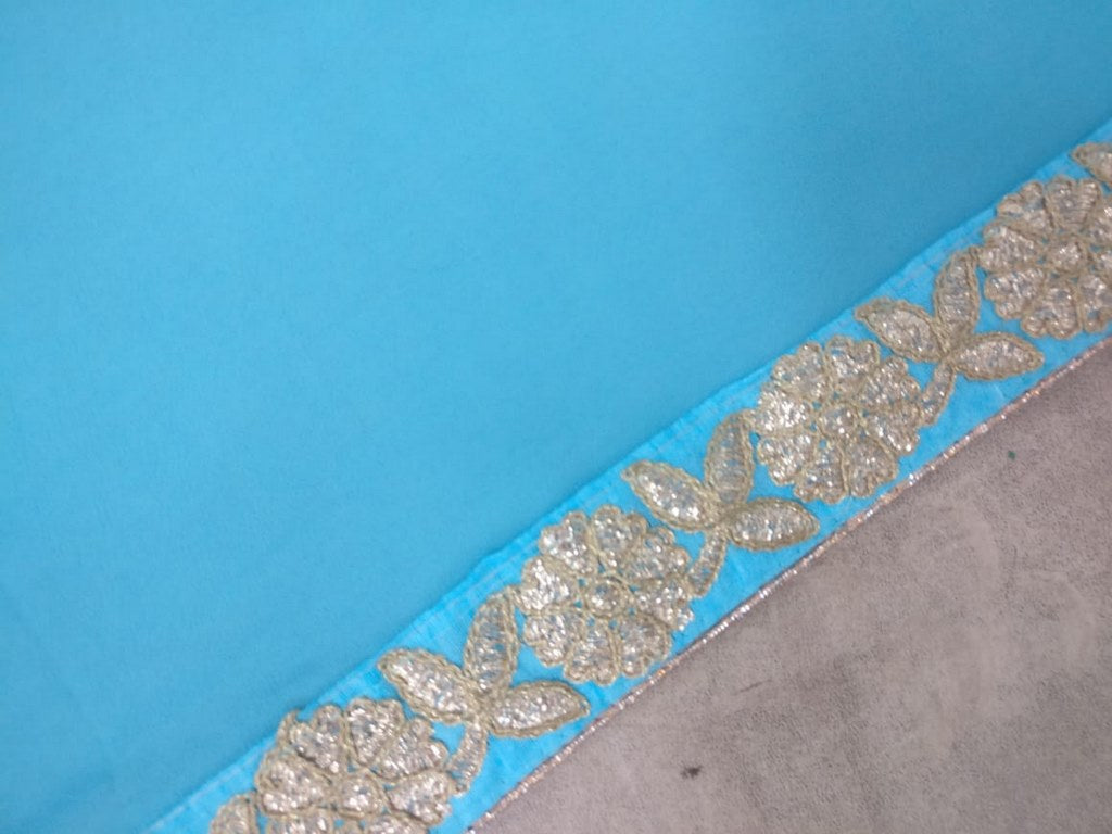 Sky blue and pink colored georgette embroidered partywear saree