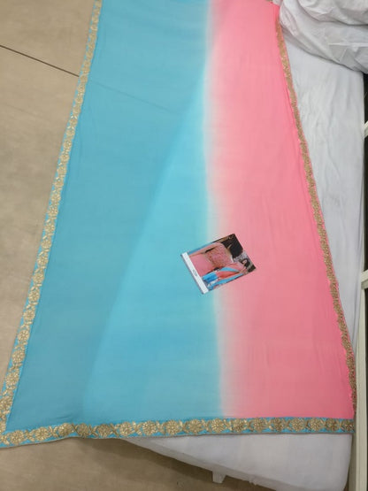Sky blue and pink colored georgette embroidered partywear saree