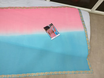 Sky blue and pink colored georgette embroidered partywear saree