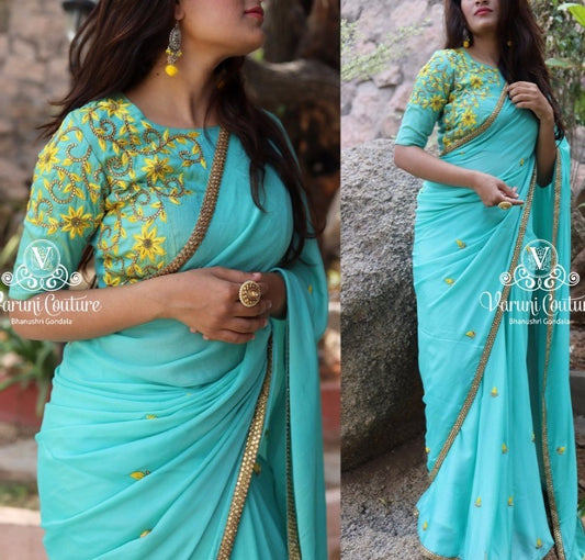 sky blue georgette partywear saree with embroidered blouse