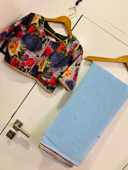 Sky blue georgette stone work saree with floral printed blouse