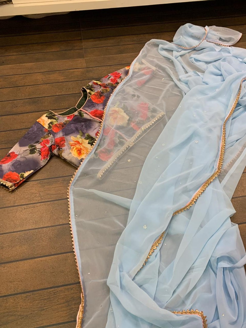 Sky blue georgette stone work saree with floral printed blouse