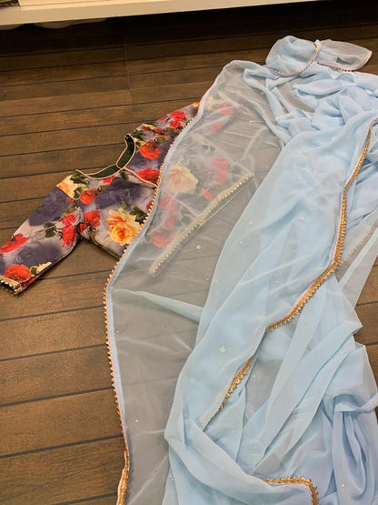 Sky blue georgette stone work saree with floral printed blouse