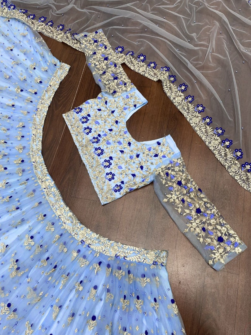 Sky blue net heavy embroidered ceremonial lehenga choli