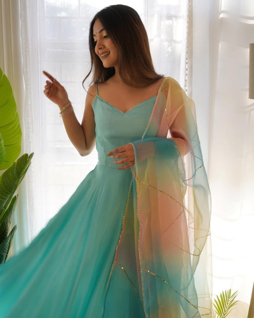 Sky blue plain gown with rainbow organza dupatta