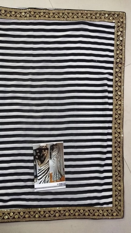 Stylist black and white strip embroidered partywear saree