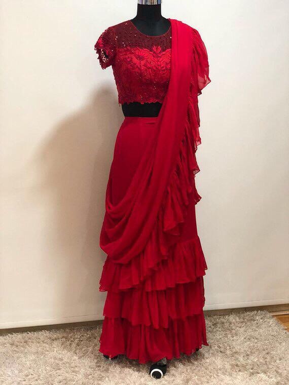 Red Stylist partywear ruffle saree with net embroidered blouse