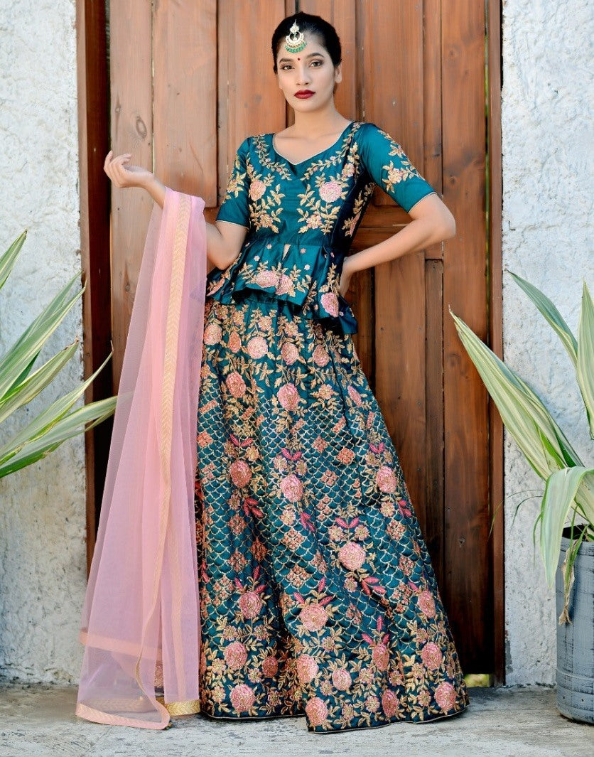 Teal green heavy embroidered wedding lehenga with long stylist choli