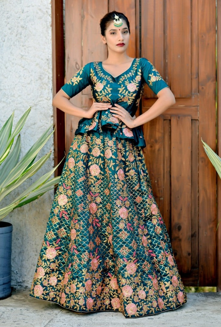 Teal green heavy embroidered wedding lehenga with long stylist choli