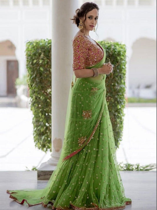 Trendy green embroidered mono net wedding saree