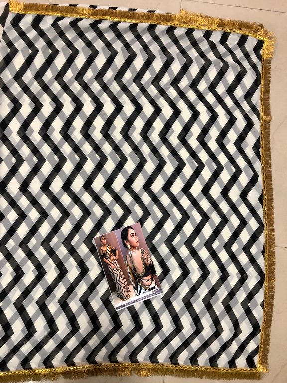 White georgette print partywear saree with embroidered blouse