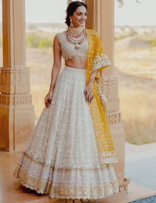 White heavy embroidery worked wedding lehenga choli