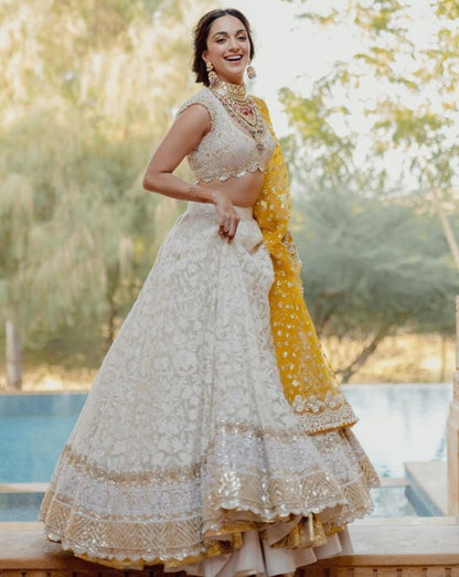 White heavy embroidery worked wedding lehenga choli