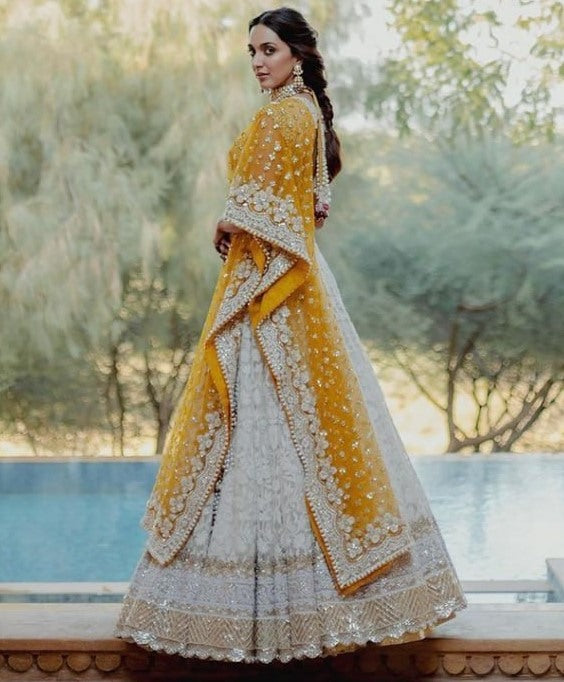 White heavy embroidery worked wedding lehenga choli