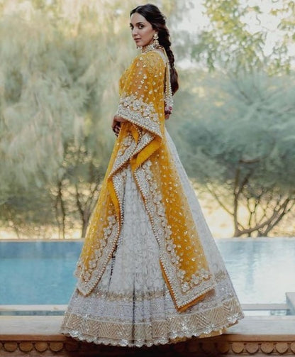 White heavy embroidery worked wedding lehenga choli