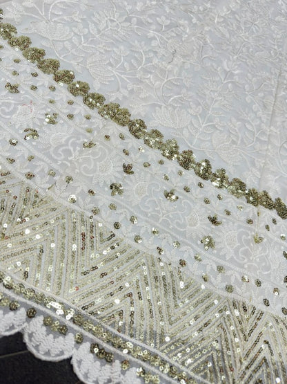 White heavy embroidery worked wedding lehenga choli