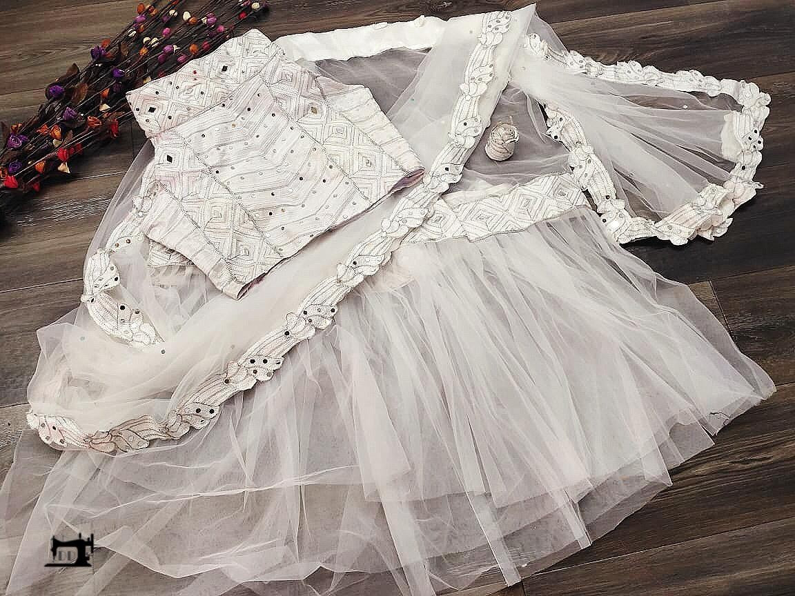 White heavy soft net designer saree