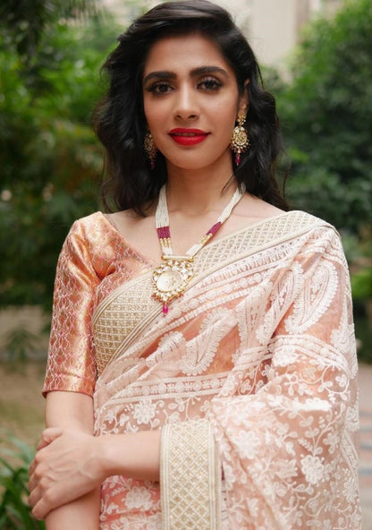 White heavy soft net embroidered saree