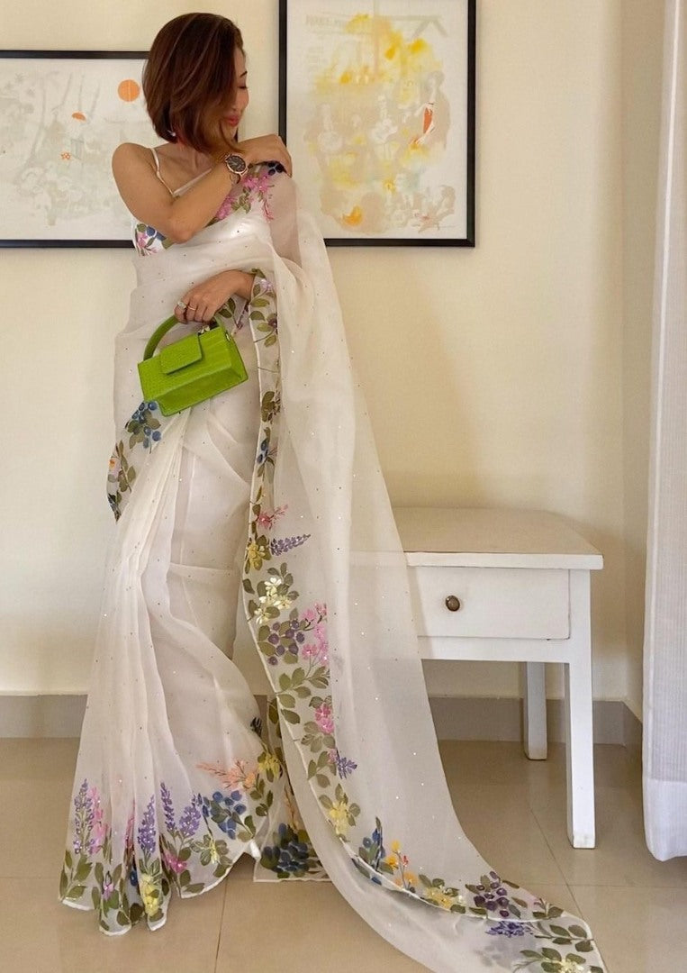 White organza print and hand worked saree