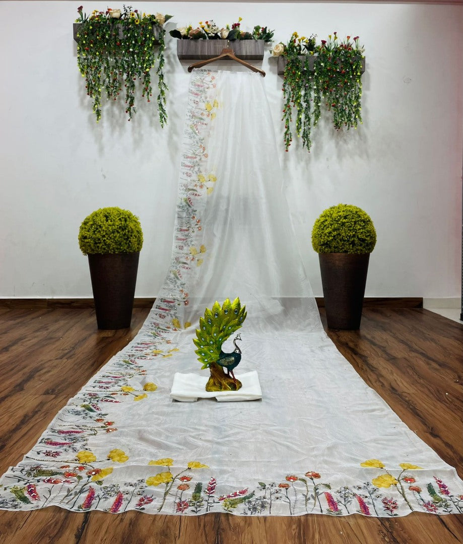 White organza print and hand worked saree