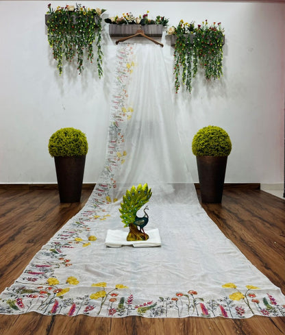 White organza print and hand worked saree