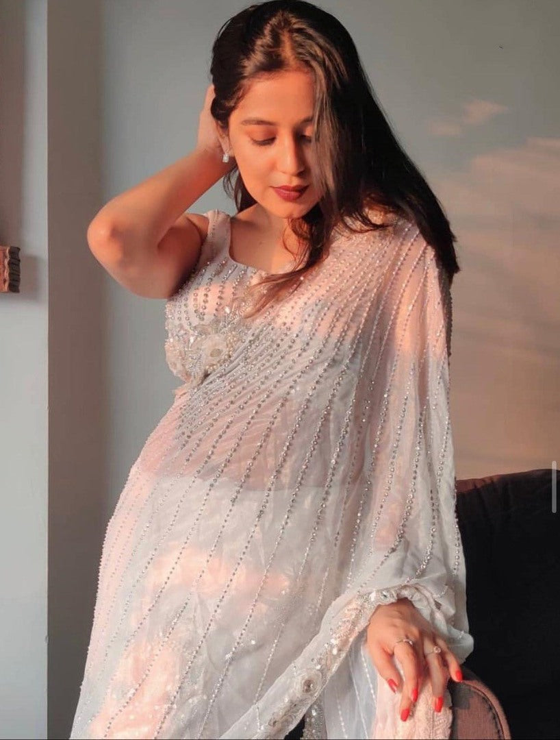 White organza silk zari embroidered and mirror work saree