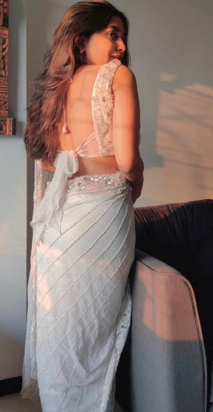 White organza silk zari embroidered and mirror work saree