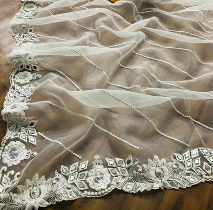 White organza silk zari embroidered and mirror work saree