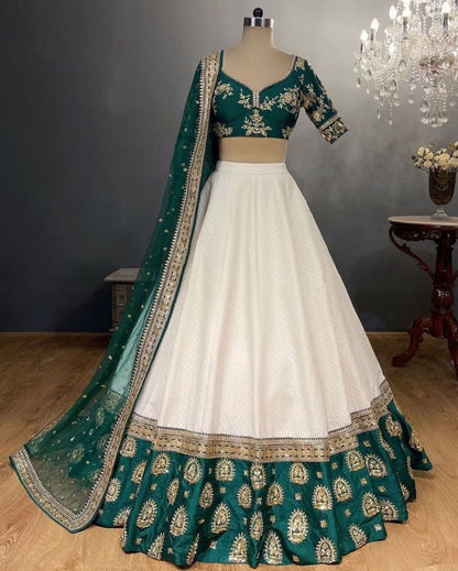 White tapeta silk green border embroidered wedding lehenga choli